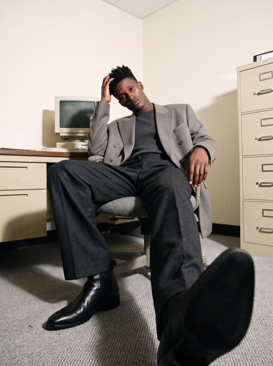 A founder reclining in an office chair, one hand in his hair